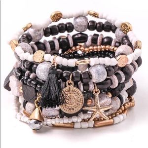 Gorgeous black white and gold star stack bracelets